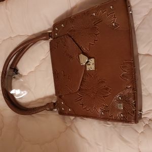 This is the purse you need it locks up with a key leather